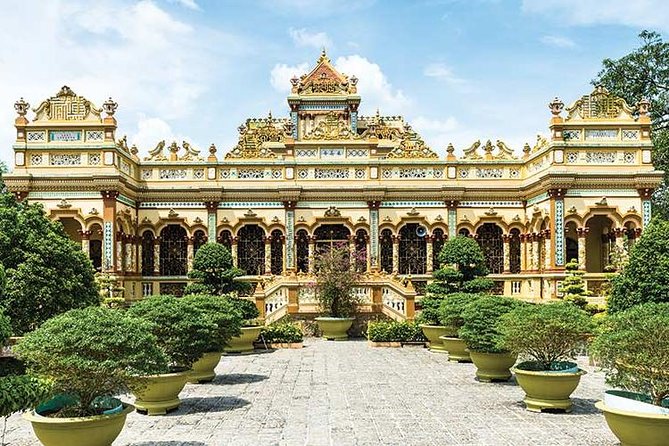 From HCM City: Mekong Delta Tour with Sampan Journey - Unicorn Islet by sampan: fruit, folk music, and honey tea
