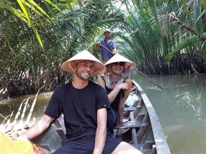 From HCM City: Visit Mekong Delta With Maximum 12 People - Vĩnh Tràng Pagoda in Mỹ Tho: giant Buddha statues and mixed architecture