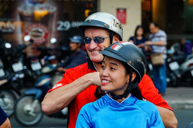 Ho Chi Minh City Tour by Motorbike with Female Riders | KissTour - Stop 1: Saigon by Scooter With a Female Guide in Ao Dai
