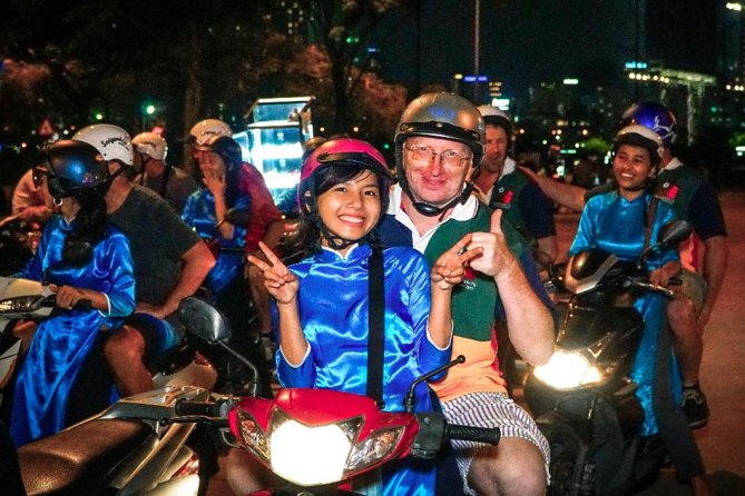 Ho Chi Minh Night Tour by Motorbikes with Female Rider | KissTour - Stop-by-stop: Opera House to apartments to Ho Thị Kỷ flower market