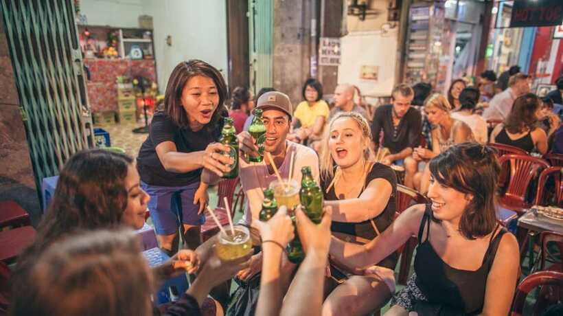 Saigon at Sunset: Ultimate Street Food Experience - District Streets After Dark: Street Beer with Peanuts and Rice Crackers