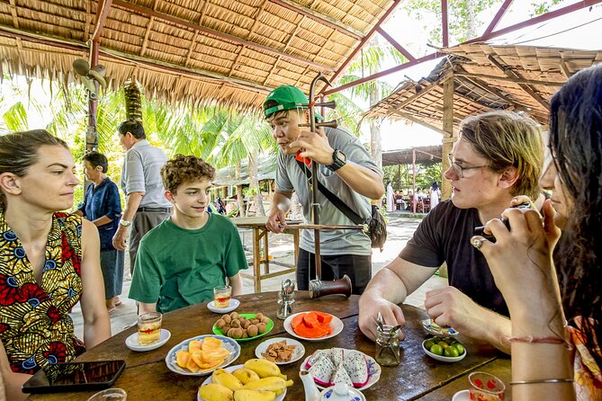 Small-Group Mekong Delta Day Trip: Boat Ride, Cottages & Pagoda - Lang Xanh riverside lunch: food, drinks, and a calm reset